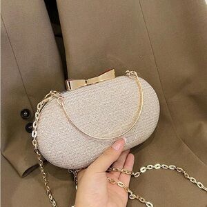 Elegant Cream Clutch with Gold Chain